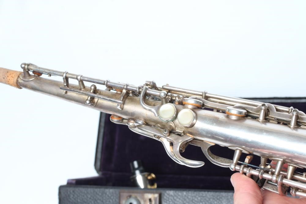 A BUESCHER SILVER PLATED SOPRANO SAXOPHONE, marked Low Pitch, with True-Tone logo and reg. no. Image