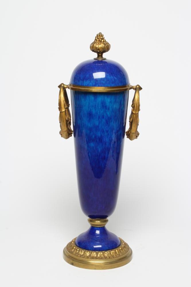 A FRENCH NEOCLASSIC STYLE GARNITURE VASE, 20th century, the blue ceramic tapering body with ormolu Image