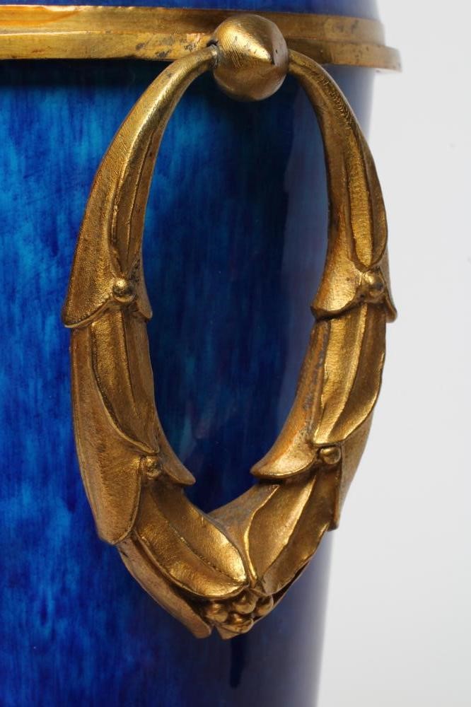A FRENCH NEOCLASSIC STYLE GARNITURE VASE, 20th century, the blue ceramic tapering body with ormolu Image