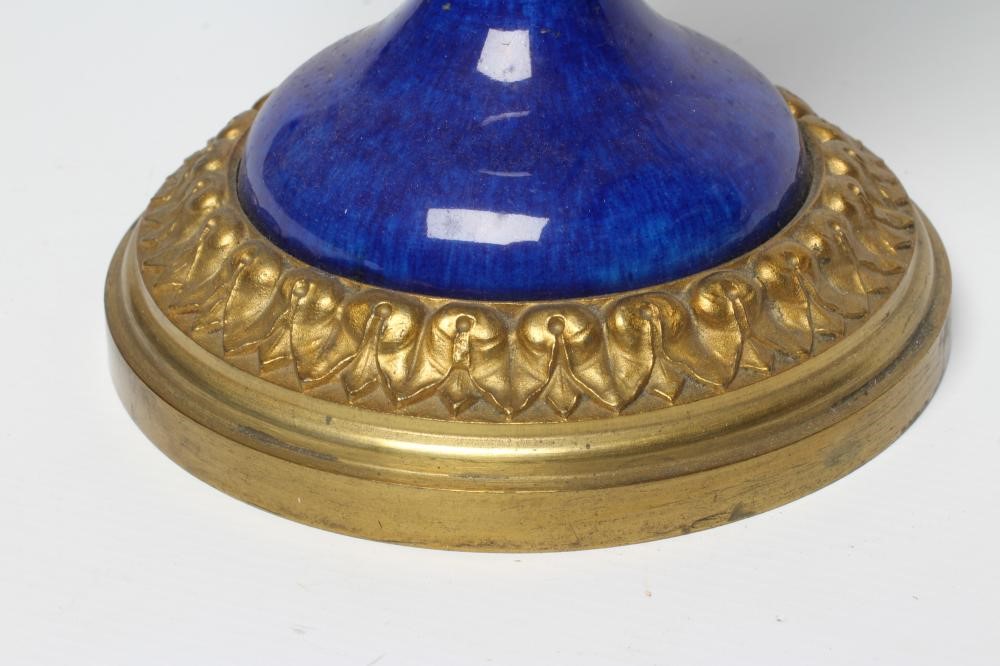 A FRENCH NEOCLASSIC STYLE GARNITURE VASE, 20th century, the blue ceramic tapering body with ormolu Image