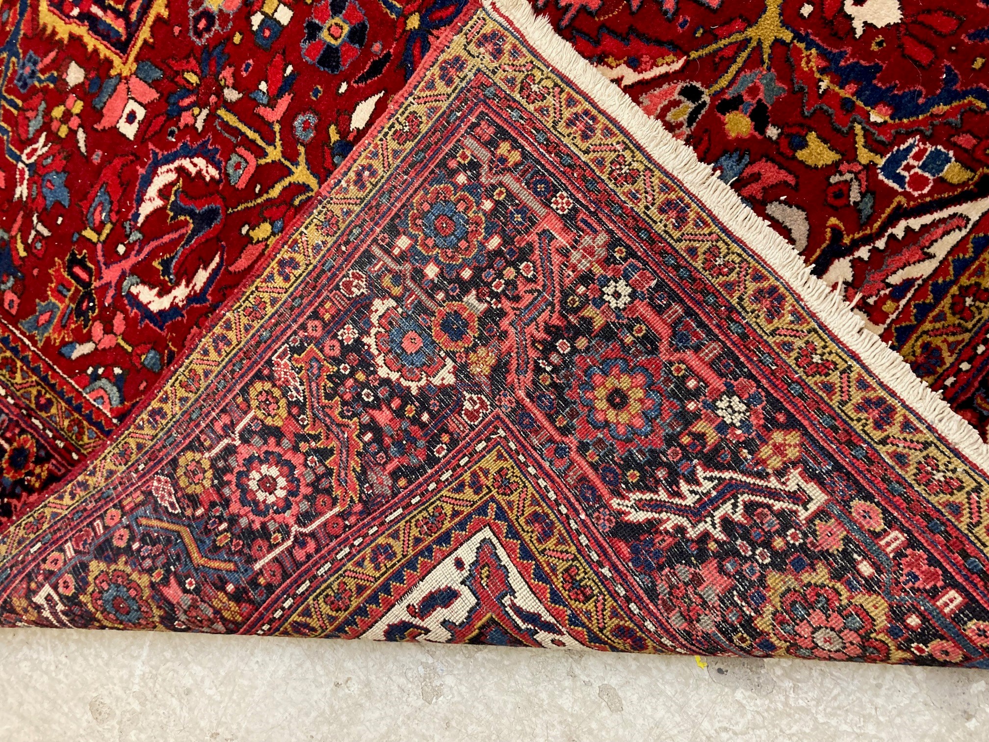 AN HERIZ CARPET, mid 20th century, the terracotta field with central flowerhead medallion bordered Image