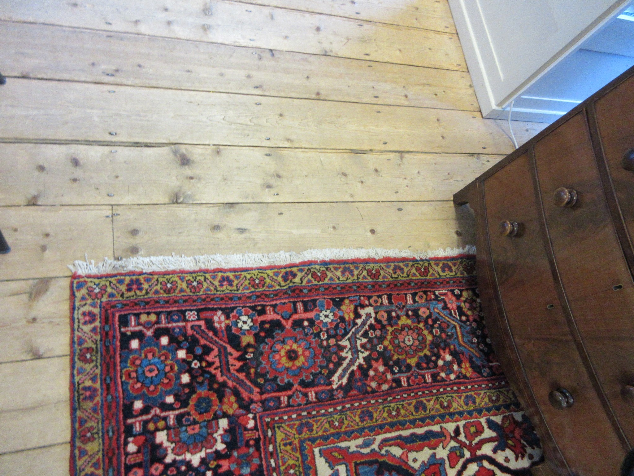 AN HERIZ CARPET, mid 20th century, the terracotta field with central flowerhead medallion bordered Image