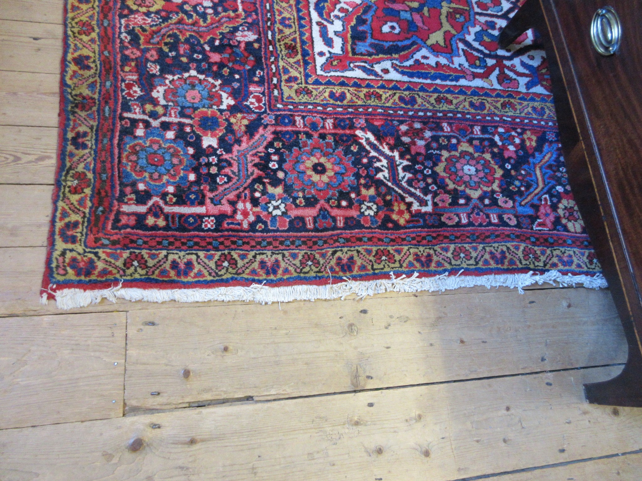 AN HERIZ CARPET, mid 20th century, the terracotta field with central flowerhead medallion bordered Image