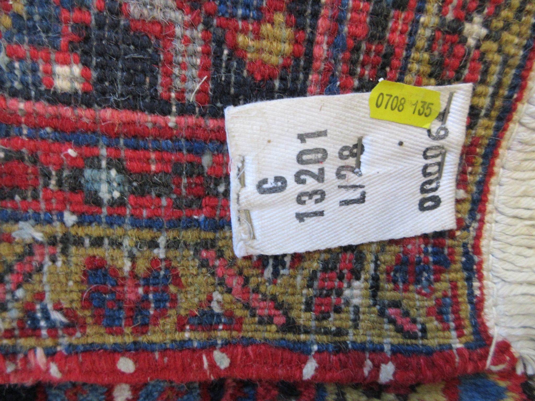 AN HERIZ CARPET, mid 20th century, the terracotta field with central flowerhead medallion bordered Image