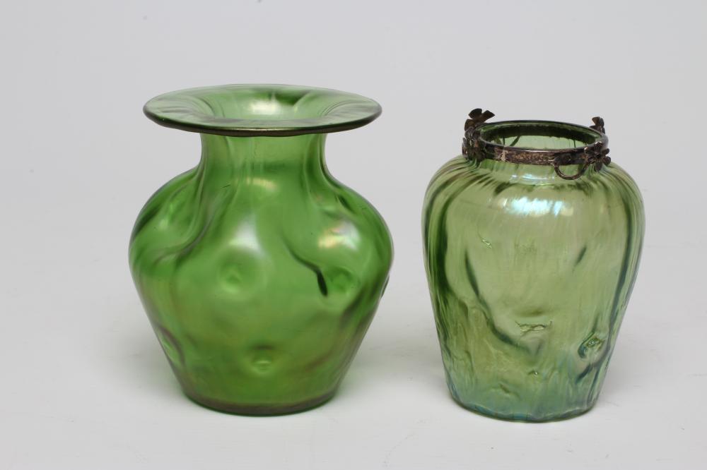 A TIFFANY STYLE IRIDESCENT GREEN GLASS VASE of flared round cylindrical form with bark type moulding Image