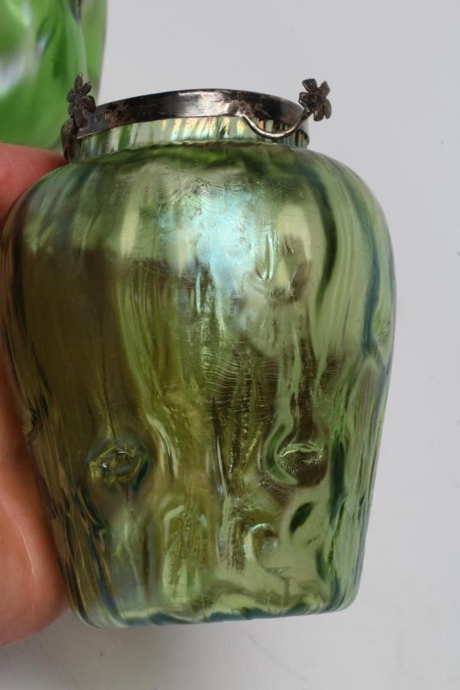 A TIFFANY STYLE IRIDESCENT GREEN GLASS VASE of flared round cylindrical form with bark type moulding Image