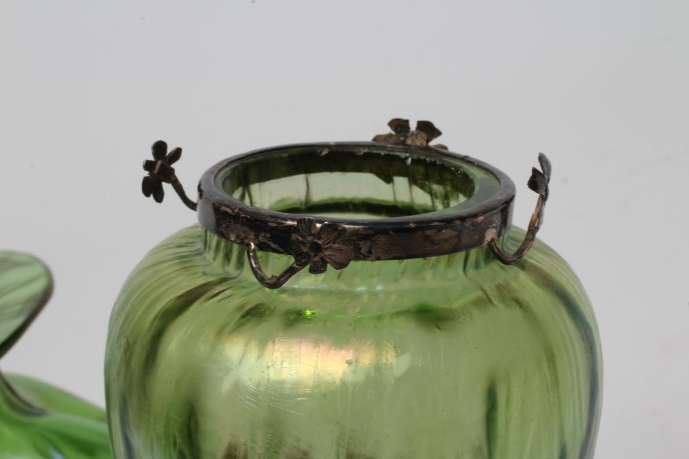 A TIFFANY STYLE IRIDESCENT GREEN GLASS VASE of flared round cylindrical form with bark type moulding Image
