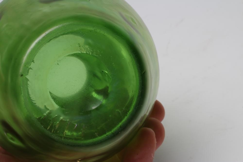 A TIFFANY STYLE IRIDESCENT GREEN GLASS VASE of flared round cylindrical form with bark type moulding Image