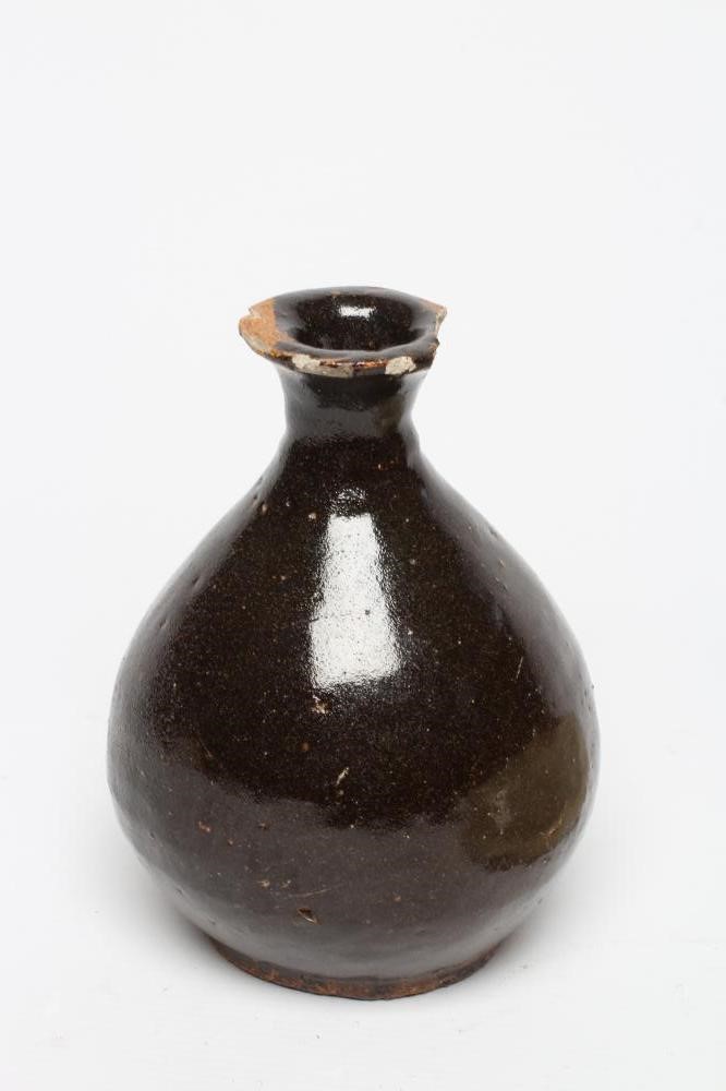 A CHINESE CELADON GLAZED STONEWARE SHALLOW BOWL of plain circular form Image