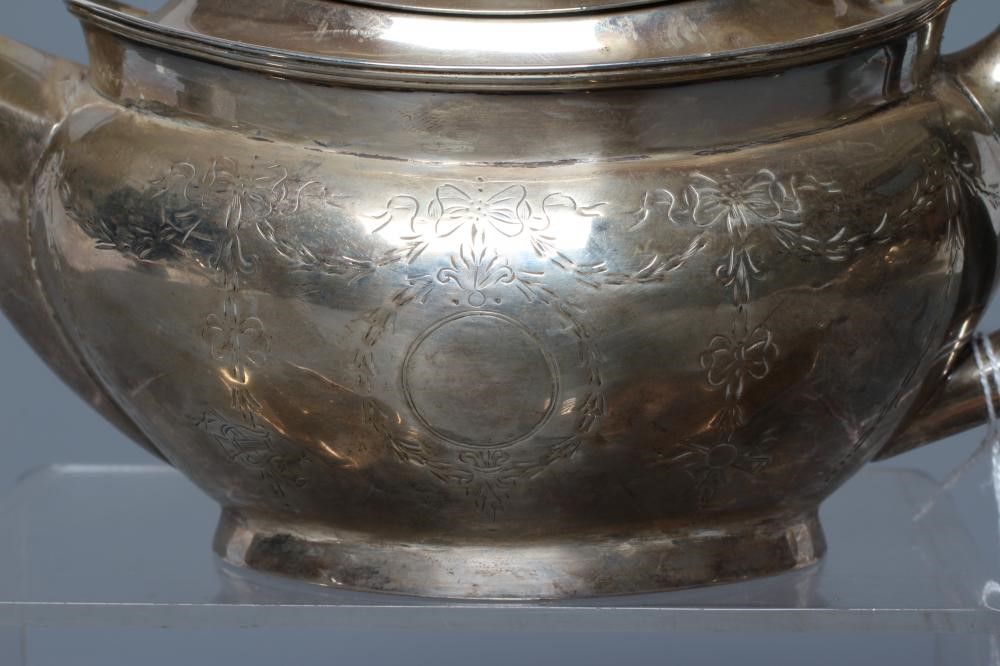 A BACHELOR'S EDWARDIAN SILVER THREE PIECE TEA SERVICE Image