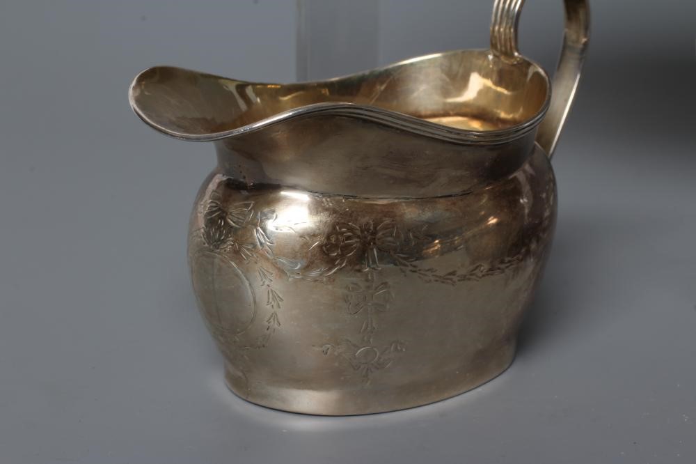 A BACHELOR'S EDWARDIAN SILVER THREE PIECE TEA SERVICE Image