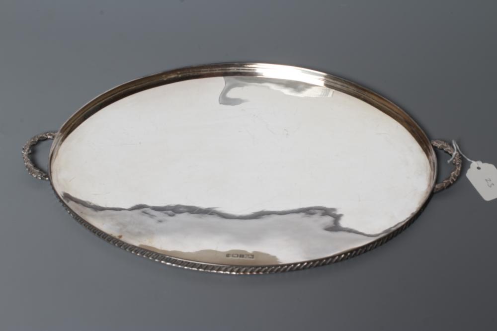 A SILVER TRAY, by Frank Cobb, Sheffield 1983, of plain oval form with two cast leaf handles and low Image