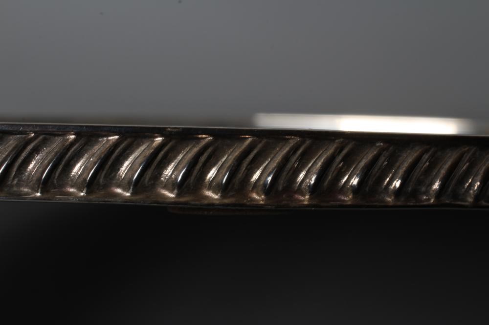 A SILVER TRAY, by Frank Cobb, Sheffield 1983, of plain oval form with two cast leaf handles and low Image