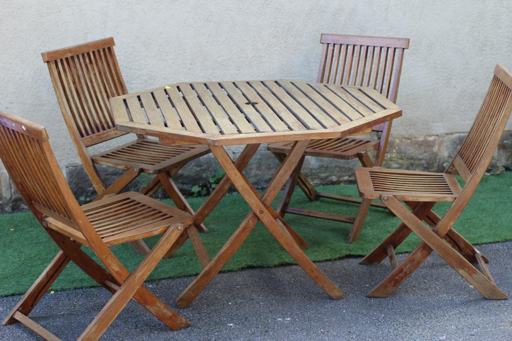 A SLATTED HARDWOOD DINING SUITE, comprising folding octagonal table, 43 1/2" wide, ensuite with four Image