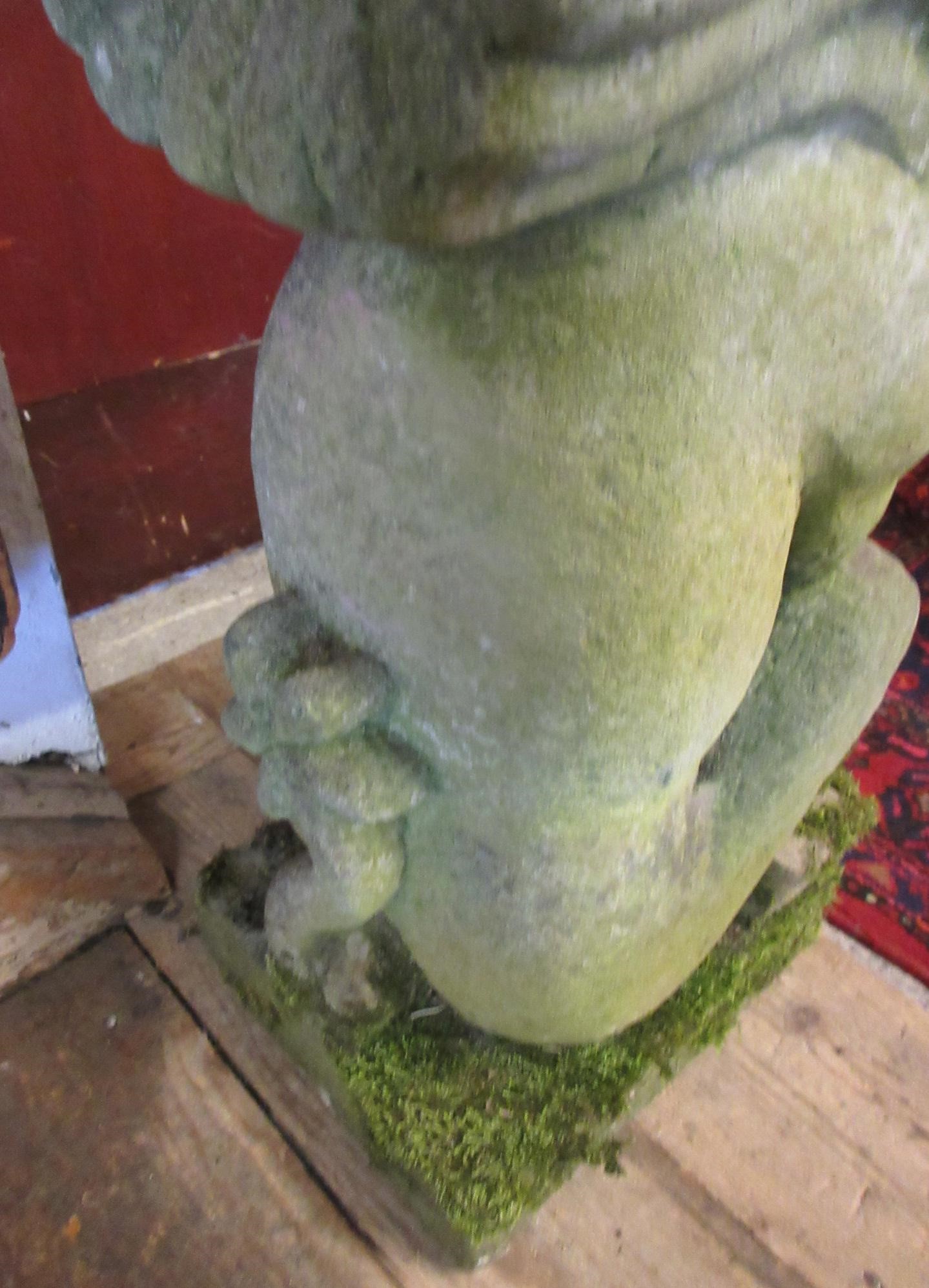 A CARVED SANDSTONE BEARDED GARGOYLE modelled seated with paw feet and open mouth, 7" x 20 1/2" Image