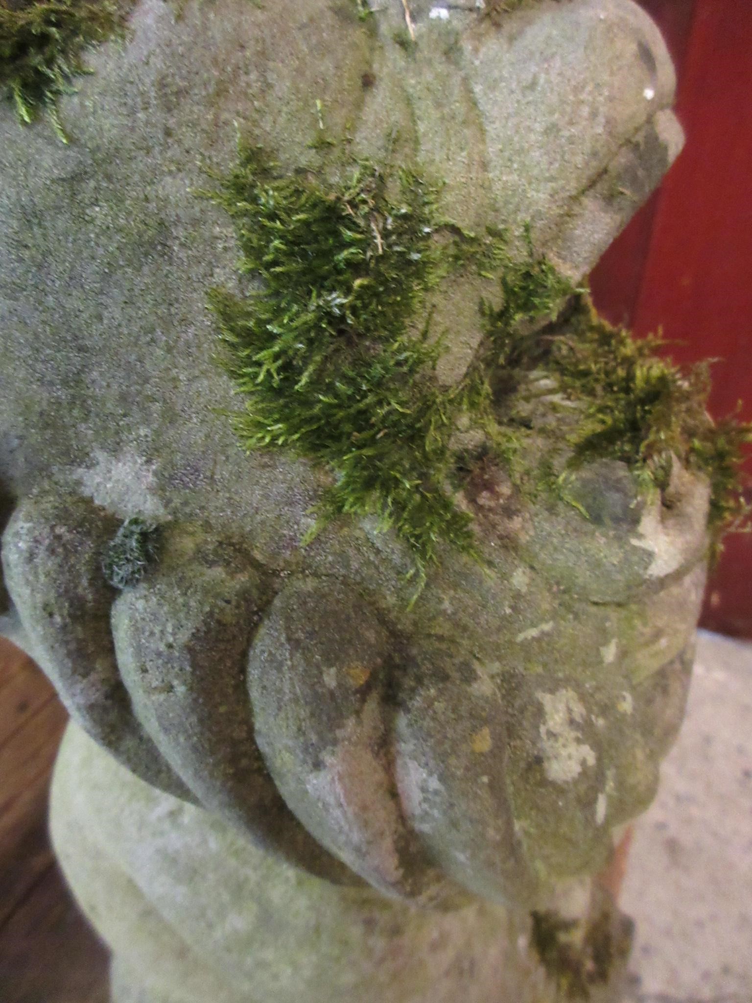 A CARVED SANDSTONE BEARDED GARGOYLE modelled seated with paw feet and open mouth, 7" x 20 1/2" Image