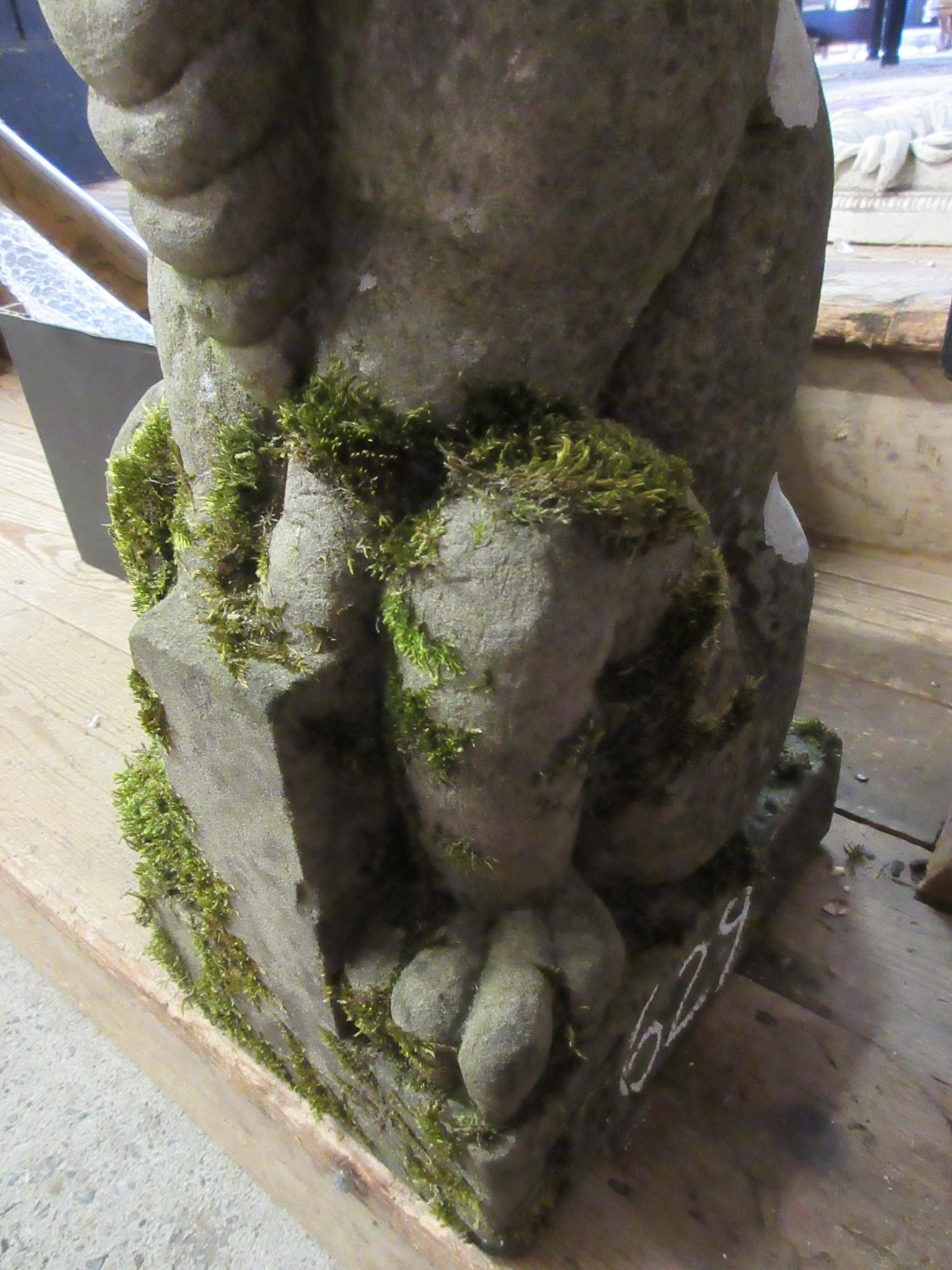 A CARVED SANDSTONE BEARDED GARGOYLE modelled seated with paw feet and open mouth, 7" x 20 1/2" Image