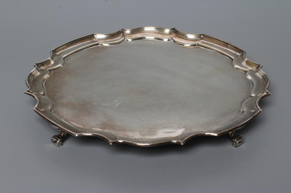 A SMALL SILVER SALVER, by James Dixon & Sons, Sheffield 1934, of shaped circular form with pie-crust Image