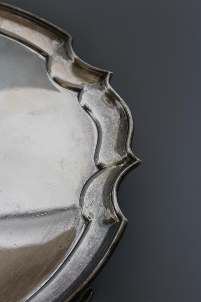 A SMALL SILVER SALVER, by James Dixon & Sons, Sheffield 1934, of shaped circular form with pie-crust Image