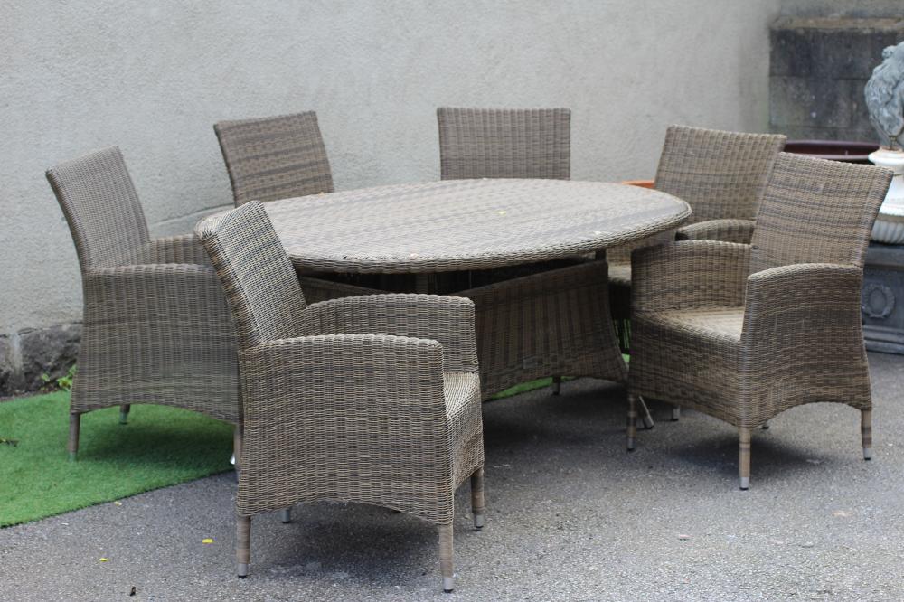A HARTMAN RESIN WEAVE DINING SUITE Image