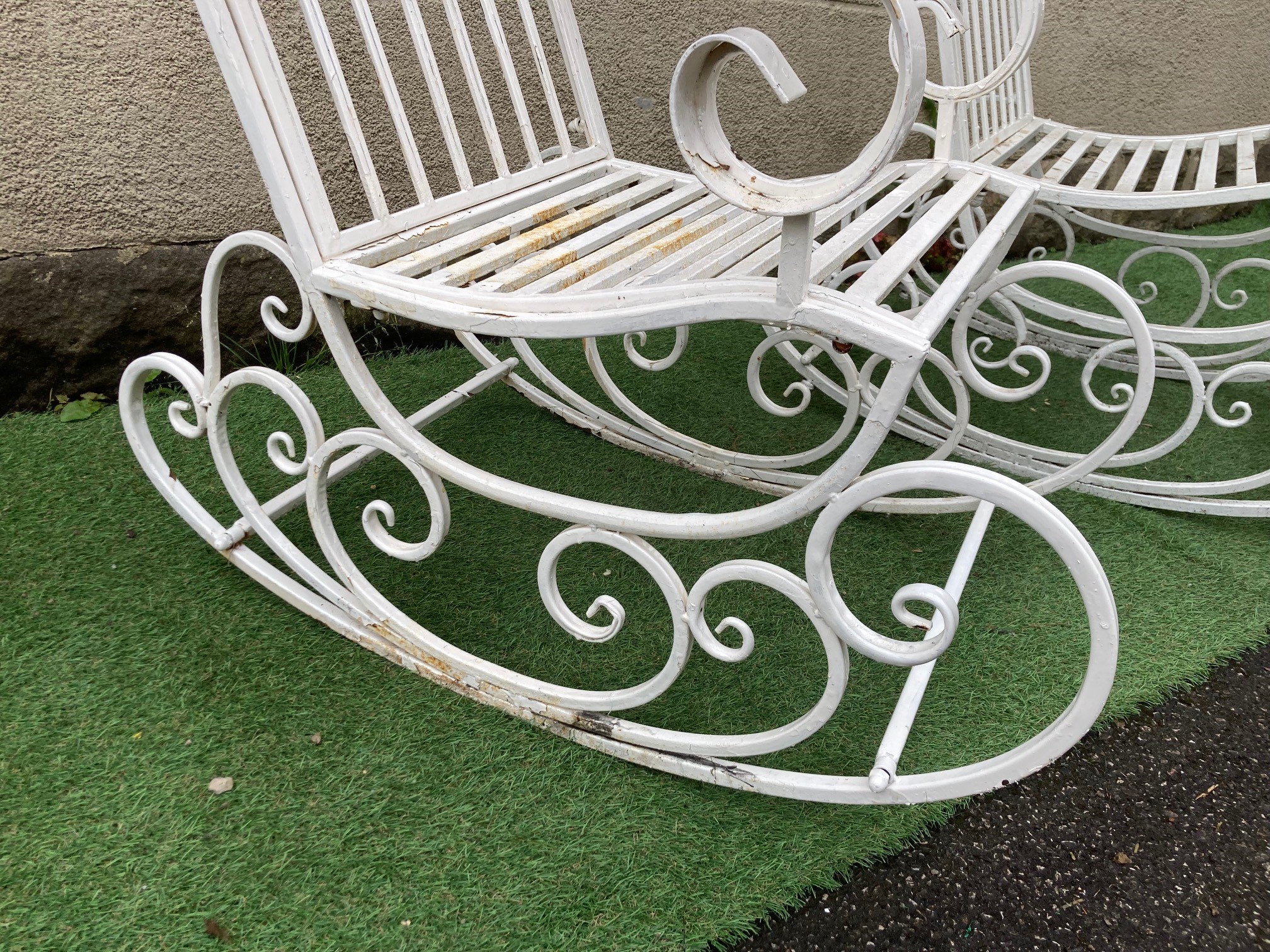 A PAIR OF METAL ROCKING CHAIRS Image