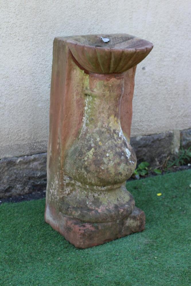 A CARVED STONE FLAT BACK BIRD BATH, with fluted bowl, Image