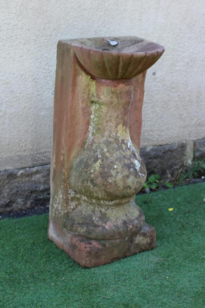A CARVED STONE FLAT BACK BIRD BATH, with fluted bowl, Image