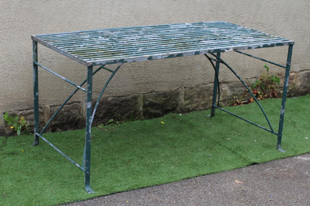 A GALAVANISED METAL STRAPWORK TABLE of oblong form with end supports joined by an arched stretcher, Image
