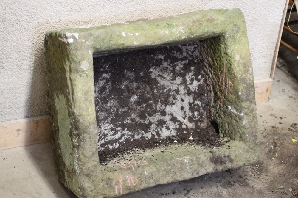 A SANDSTONE TROUGH of rough hewn oblong form, 29 1/2" x 23 1/2" x 16 1/2" (Est. plus 24% premium Image