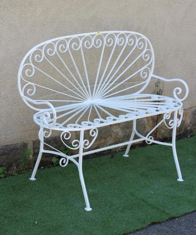 A CAST AND WROUGHT METAL BENCH, with arched sunburst back and corresponding metal seat, scrolled arm Image