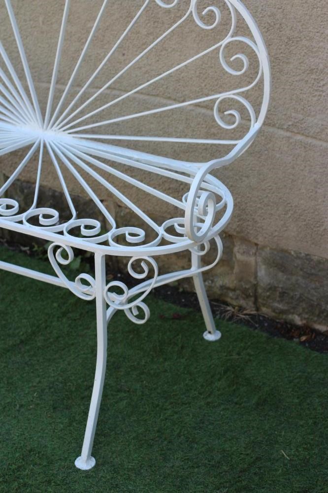 A CAST AND WROUGHT METAL BENCH, with arched sunburst back and corresponding metal seat, scrolled arm Image