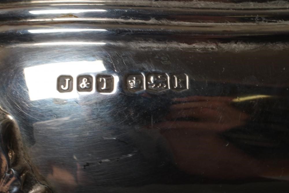 A THREE PIECE SILVER TEA SERVICE Image