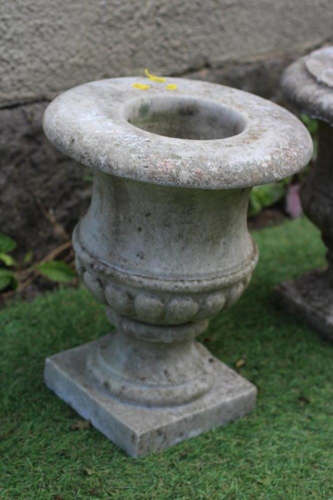 A SMALL PAIR OF WHITE MARBLE URNS of half fluted campana form with everted rim and square base, 9 Image