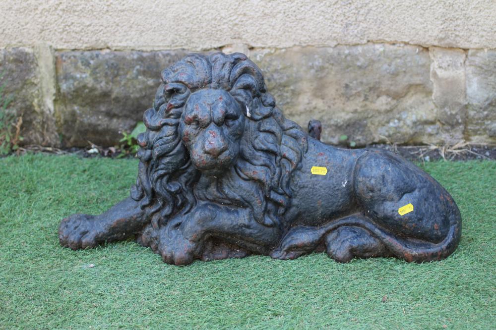 A VICTORIAN CAST IRON HERALDIC RECUMBENT LION, possibly a fireplace ornament, 26" x 14" (Est. plus Image