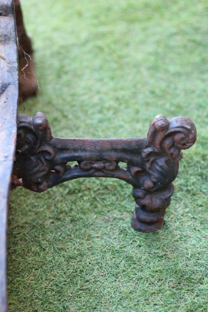 A VICTORIAN CAST IRON HERALDIC RECUMBENT LION, possibly a fireplace ornament, 26" x 14" (Est. plus Image