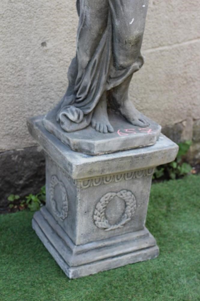 A CAST STONE FIGURE OF A NYMPH, raised on square wreath moulded plinth, 13 1/2" x 59 1/2" (Est. plus Image