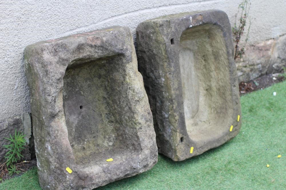 A SMALL SANDSTONE TROUGH of well cut rounded oblong form, 22 1/2" x 16" x 8", together with another Image