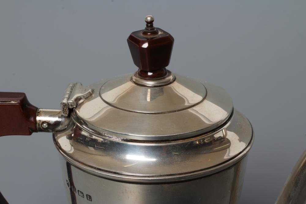 AN ART DECO SILVER COFFEE POT Image