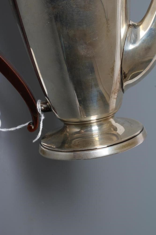AN ART DECO SILVER COFFEE POT Image
