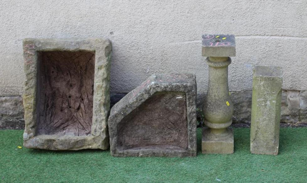 A SMALL SANDSTONE TROUGH of rough hewn oblong form 23" x 18 1/2" x 9" Image