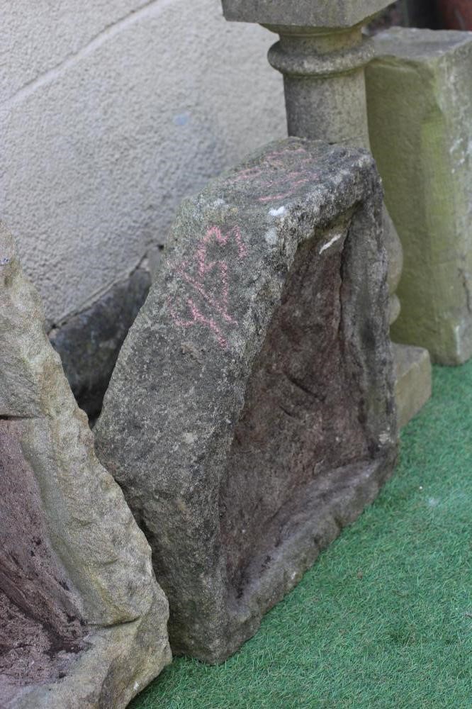 A SMALL SANDSTONE TROUGH of rough hewn oblong form 23" x 18 1/2" x 9" Image