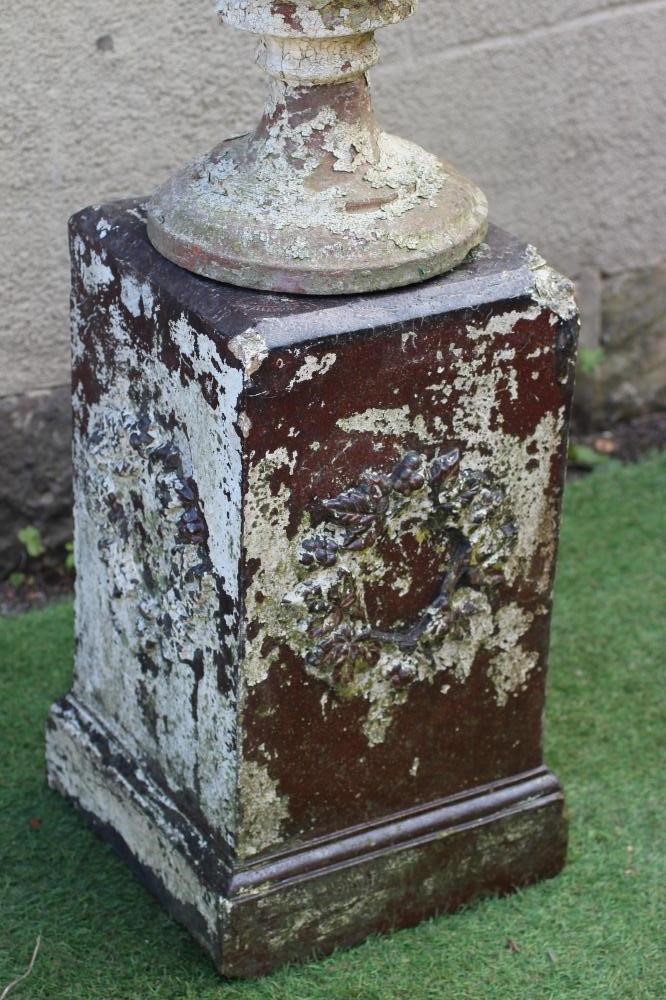 A TERRACOTTA URN of half fluted campana form on moulded circular base, raised on associated salt Image