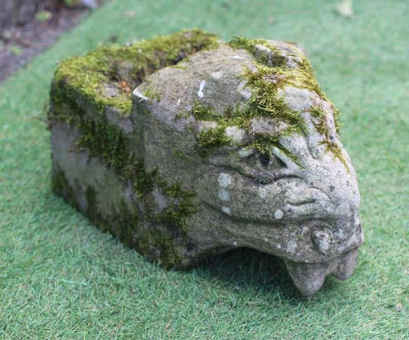 A SANDSTONE GARGOYLE carved as a mythical beast on oblong plinth, 8 1/2" x 15" (Est. plus 24% Image