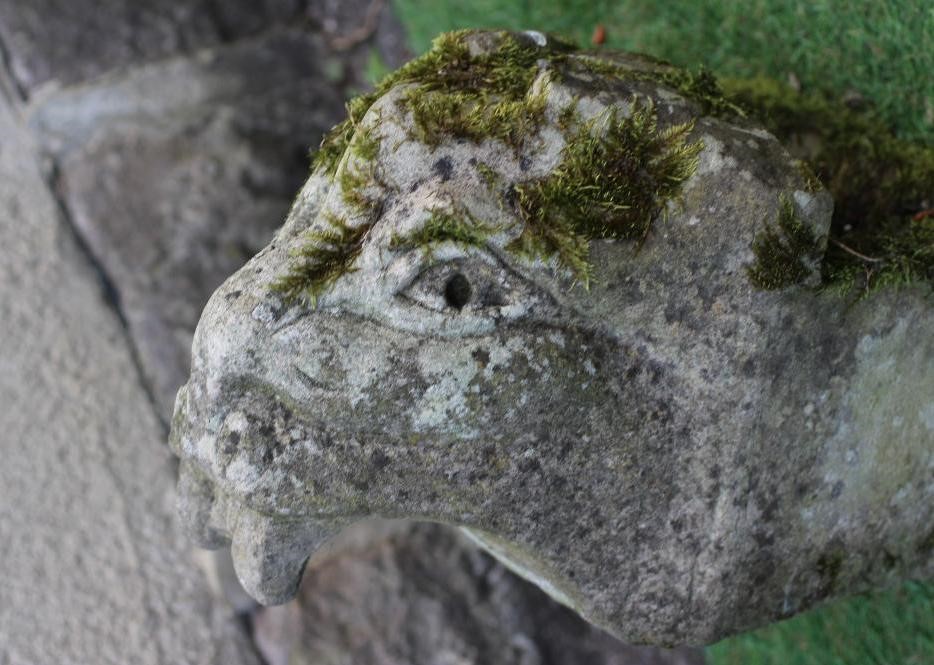A SANDSTONE GARGOYLE carved as a mythical beast on oblong plinth, 8 1/2" x 15" (Est. plus 24% Image