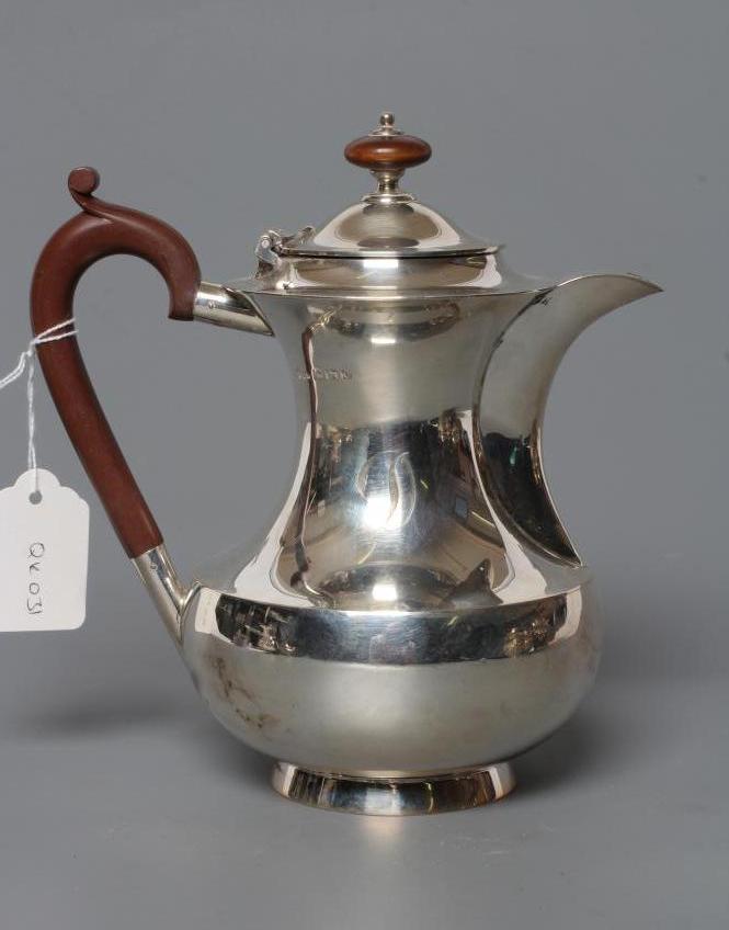A SILVER HOT WATER JUG Image