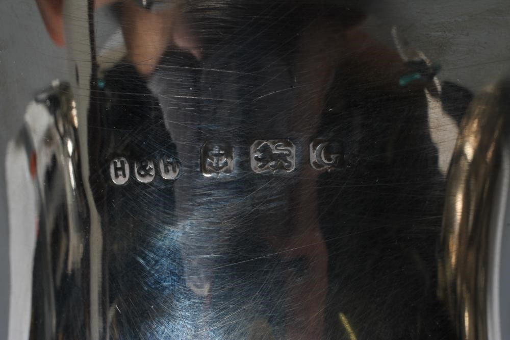 A SILVER HOT WATER JUG Image