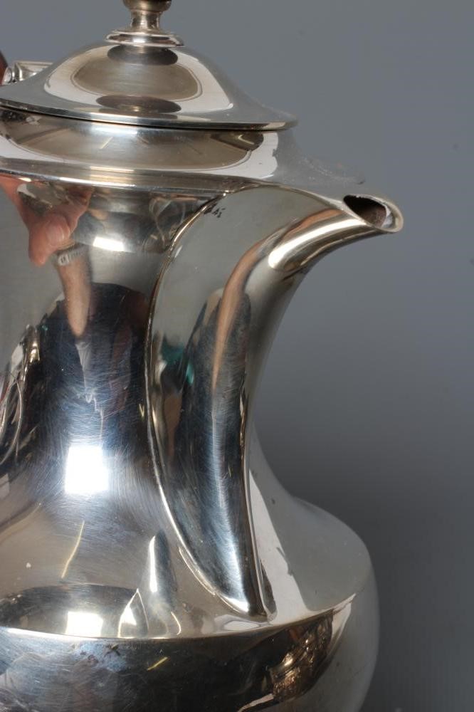 A SILVER HOT WATER JUG Image