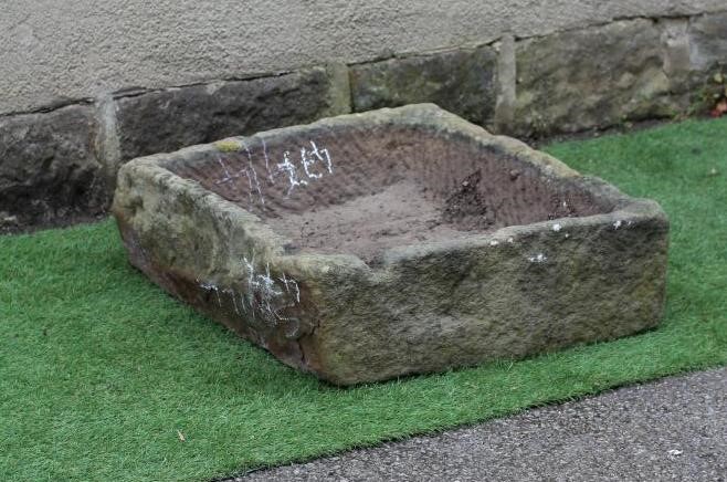 A SANDSTONE TROUGH of rough hewn oblong form Image