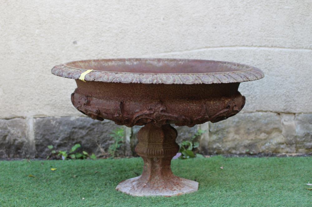 A VICTORIAN CAST IRON URN, the large shallow bowl with strapwork banding and egg and dart moulded Image