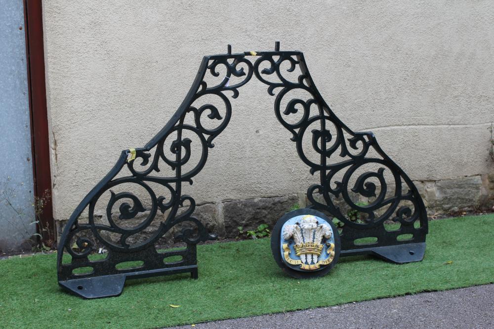 A VICTORIAN CAST AND WROUGHT IRON ARCH with shaped sides and open scrollwork, surmounted by a Image
